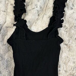 Black ruffle body suit